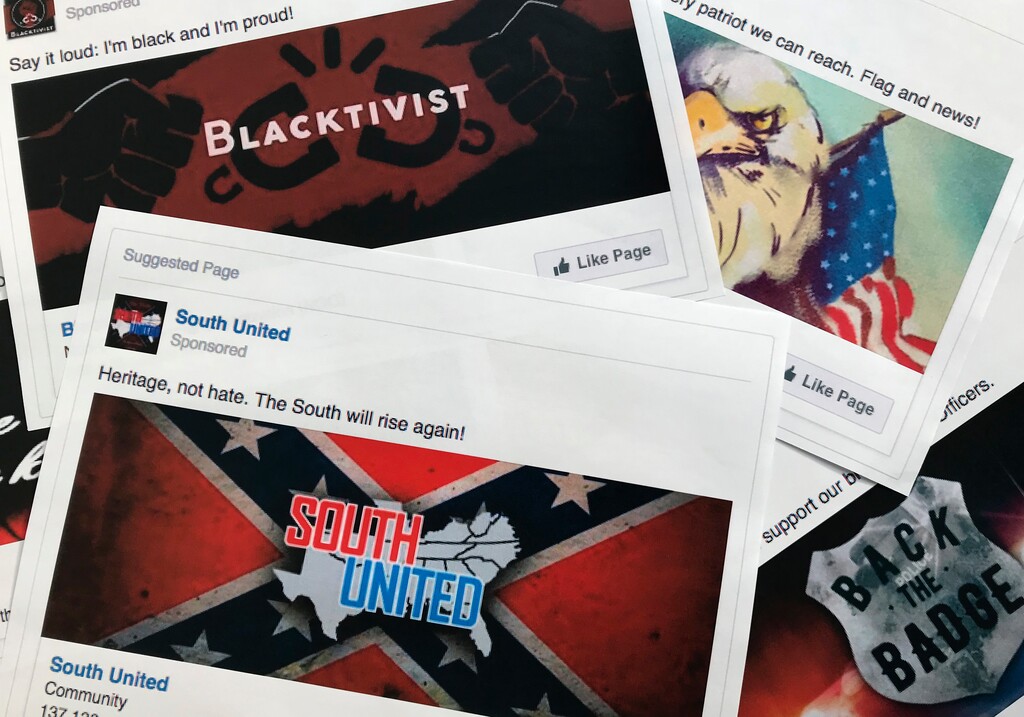 (Jon Elswick | AP file photo) Prints of some of the Facebook ads linked to a Russian effort to disrupt the American political process and stir up tensions around divisive social issues, released by members of the U.S. House Intelligence committee, in Washington in November 2017.