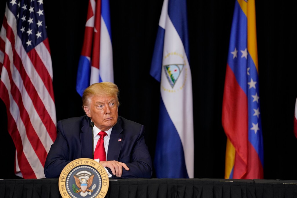 (Evan Vucci | AP file photo)  President Donald Trump listens during a roundtable on Venezuela at Iglesia Doral Jesus Worship Center, Friday, July 10, 2020, in Doral, Fla.