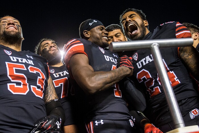(Chris Detrick  |  The Salt Lake Tribune)  Utah Utes quarterback Tyler Huntley (1) and Utah Utes defensive back Kenric Young (24) celebrate after the game at Rice-Eccles Stadium Friday, November 3, 2017.   Utah Utes defeated UCLA Bruins 48-17.