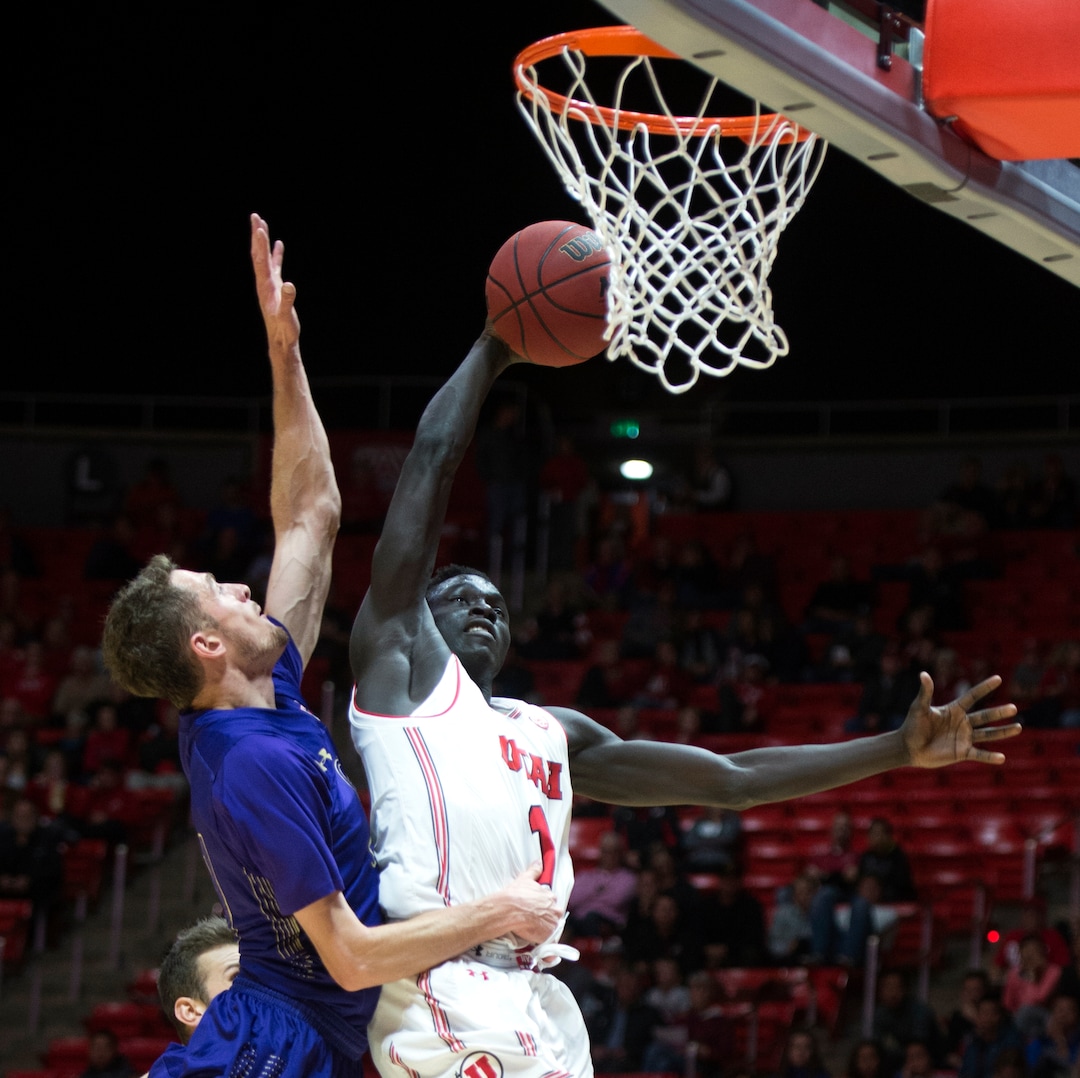 (Rick Egan  |  The Salt Lake Tribune)  Utah Utes forward Both Gach (11) beats College of Idaho forward, Connor Desaulniers to the hoop, in basketball action, between the Utah Utes and the College of Idaho Yotes at the Jon M. Huntsman Center, Thursday, Nov. 1, 2018.