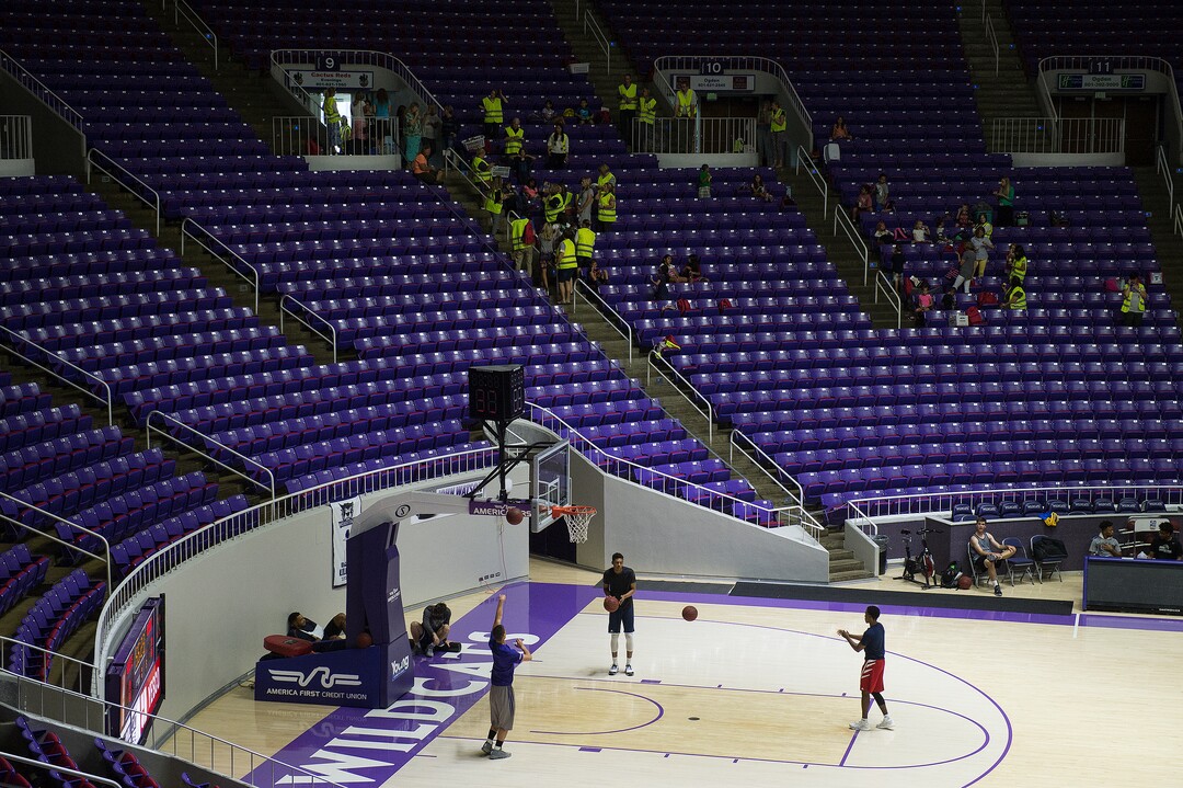 (Leah Hogsten  |  The Salt Lake Tribune) Weber State University basketball players practice in front of students of Uintah Elementary School, who were evacuated to the Dee Events Center on the Weber State University campus in Ogden, Tuesday September 5, 2017.  The Uintah Fire is still burning through the town of Uintah and pockets of South Weber, as well as the unincorporated subdivision of Uintah Highlands.