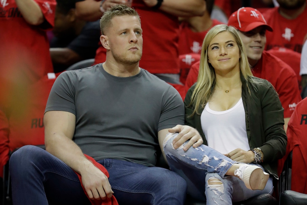 (David J. Phillip | AP) In this April 16, 2019 photo, Houston Texans' J.J. Watt, left, and his now wife, professional soccer player Kealia Watt attend Game 1 of an NBA basketball first-round playoff series between the Oklahoma City Thunder and Houston Rockets in Houston.