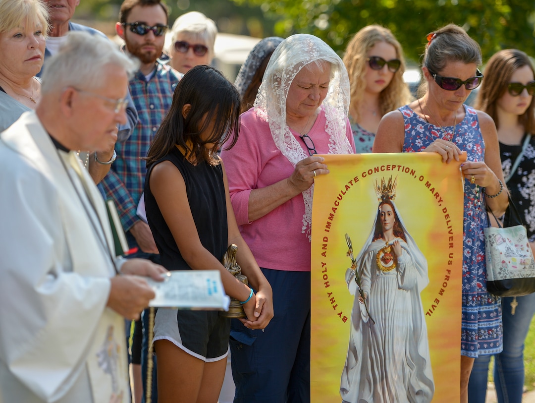 Leah Hogsten  |  The Salt Lake Tribune   Catholic priest, Rev. Jan Bednarz of St. Martin de Porres Parish in Taylorsville, leads the "blessed sacrament" and exorcism at the Planned Parenthood offices on the Feast of the Assumption. Bednarz was joined by the group, "40 Days for Life Utah," to protest Planned Parenthood. 
