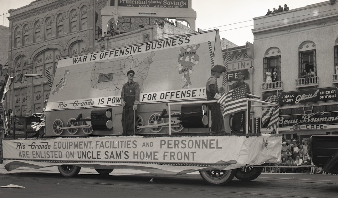 (Photo courtesy of Utah State History) A float sponsored by the Denver & Rio Grande Western Railroad touts the company's part in transporting the military, as part of the 1942 Pioneer Day parade on Salt Lake City's Main Street — held months after the United States entered World War II. The photo was originally taken by a Salt Lake Tribune staff photographer.