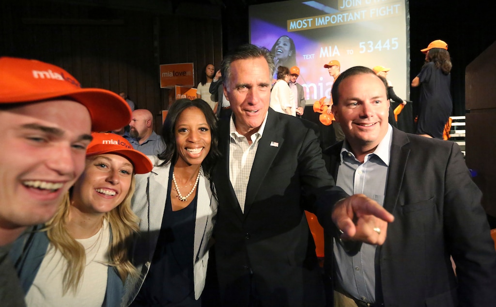 (Rick Bowmer | AP) Mia Love, center left, poses for a photograph with Mitt Romney and Sen. Mike Lee, right, during a campaign rally for Love, Friday, Aug. 24, 2018, in Lehi.