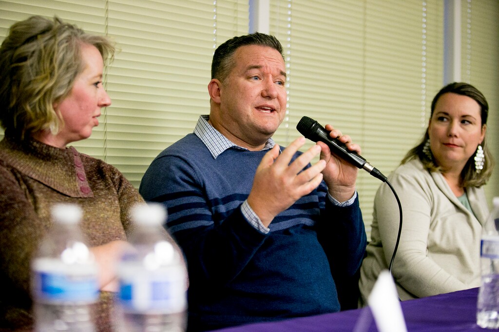 This photo taken Feb. 25, 2020, shows Arkin Hill, of West Jordan, speaking about his family's experience with foster care during a question-and-answer forum with current foster parents hosted by Utah Foster Care at the organization's state headquarters in Murray, Utah. (Isaac Hale/The Daily Herald via AP)