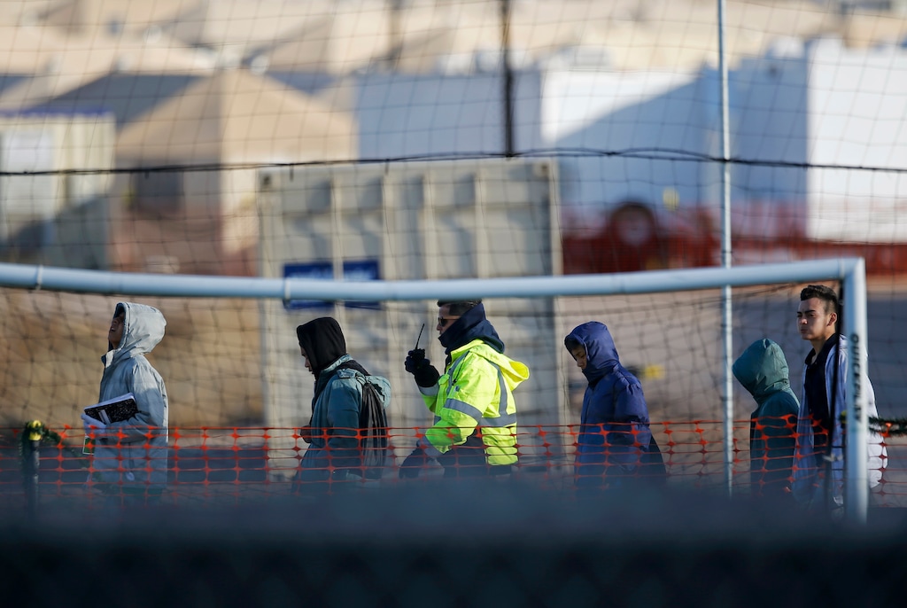 (Andres Leighton | AP file photo) In this Dec. 13, 2018, file photo, teen migrants walk in line inside the Tornillo detention camp in Tornillo, Texas. The nonprofit group running what was once the nation’s largest detention camp for migrant children confirmed it is closing down the facility and the last kids left on Friday, Jan. 11, 2019.