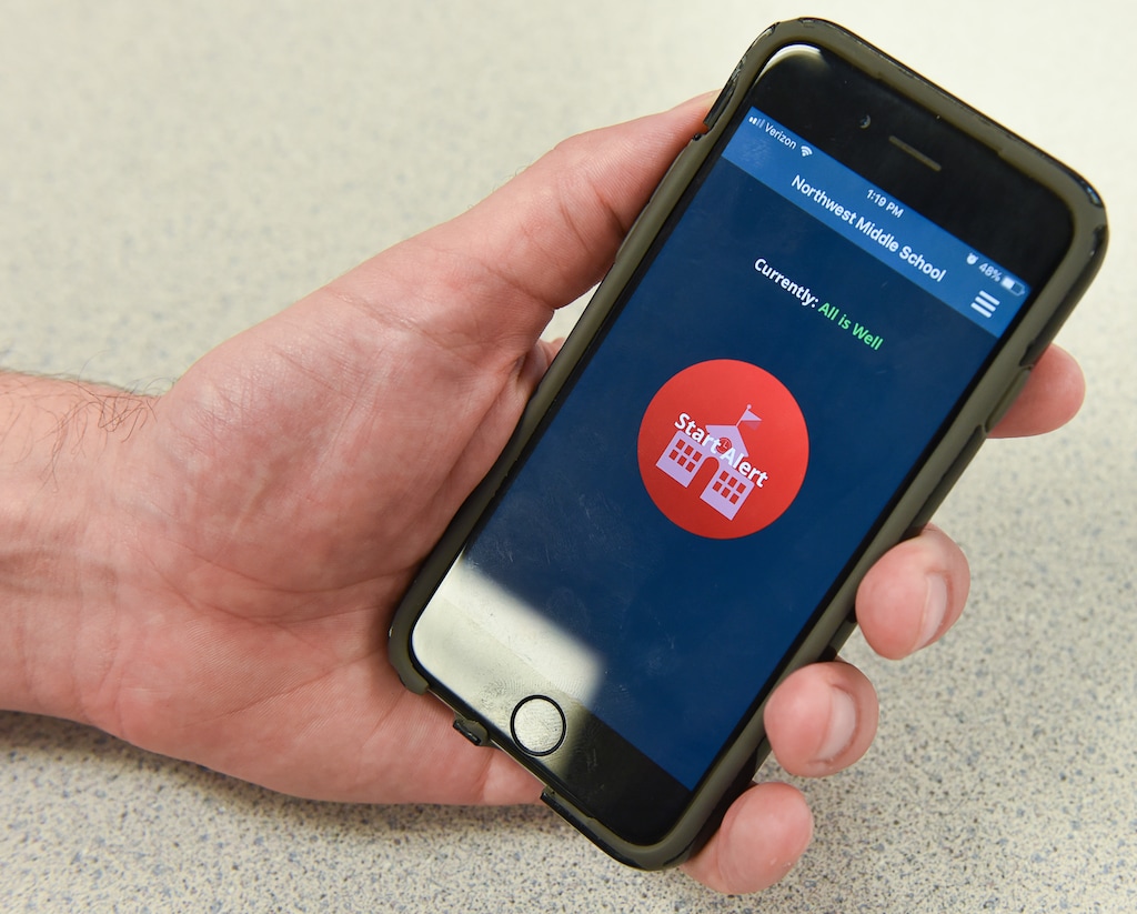 (Francisco Kjolseth  |  The Salt Lake Tribune)  Ensign Elementary school principal Erik Jacobson discusses the new DIR-S app on his phone that allows him to start an immediate alert that goes directly to police, the district and all the teachers in his school via, classroom computers, teacher phones and even smart boards. The school in Salt Lake has implemented several new safety features for the new school year. 