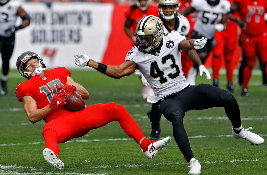 New Orleans Saints free safety Marcus Williams (43) levels Tampa Bay Buccaneers wide receiver Adam Humphries (10) after a reception during the first half of an NFL football game Sunday, Dec. 9, 2018, in Tampa, Fla. (AP Photo/Mark LoMoglio)