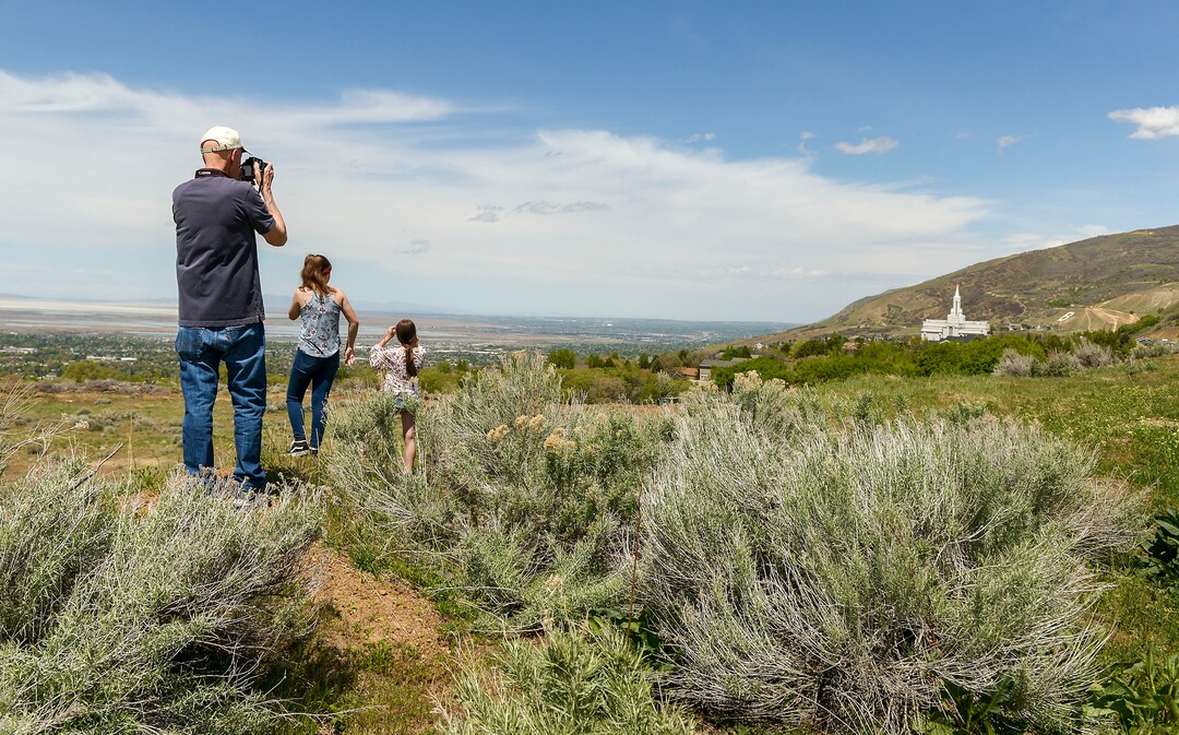 (Leah Hogsten  |  The Salt Lake Tribune) Onlookers lined Bountiful Blvd. to get a glimpse of the F-35Õs passing through Davis County.  In support of the healthcare workers, first responders and essential personnel on the front lines of the fight against COVID-19, Hill Air Force BaseÕs F-35 pilots from the Demo Team and the 388th Fighter Wing flew over the state, April 30, 2020.