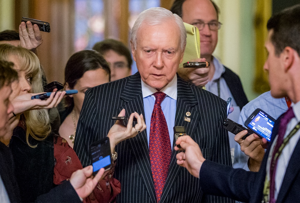 Senate Finance Committee Chairman Orrin Hatch, R-Utah, who also serves as the Senate's president pro tempore, is surrounded by reporters on the way to a meeting of the GOP leadership as lawmakers rush to wrap up their work and pass a funding bill to avert a government shutdown, at the Capitol in Washington, Monday, Dec. 14, 2015. Congressional negotiators worked through the weekend on a $1.1 trillion spending bill and a package of tax breaks, with Republicans and Democrats promising that a final product will be unveiled on Monday.  (AP Photo/J. Scott Applewhite)