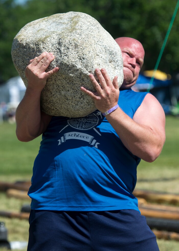 (Rick Egan  |  The Salt Lake Tribune)      Scott Chisolm competes in the stone lifting competition at the 44th annual Utah Scottish Festival and Highland Games at the Utah State Fairgrounds, Sunday, June 10, 2018.