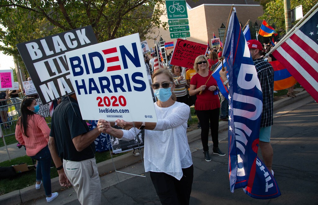 (Francisco Kjolseth | The Salt Lake Tribune) Dick and Joni Chapa counterprotest supporters of President Donald Trump as they rally outside of Kingsbury Hall on the University of Utah campus in Salt Lake City on Wednesday, Oct. 7, 2020, during the vice presidential debates.