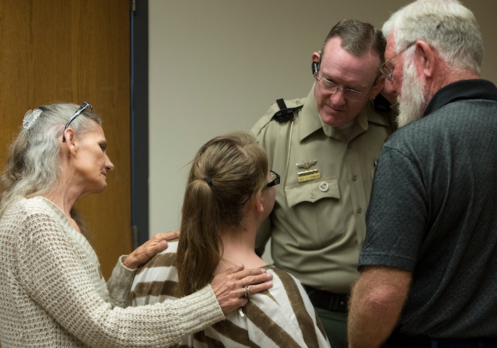     (Rick Egan  |  The Salt Lake Tribune)        NIkka Powell, Riley's sister, talks to Utah County sheriff's Sgt. Spencer Cannon as Bill Powell, Riley’s father, listens in, after Jerrod Baum appeared for a hearing in Provo. Baum is accused of killing 18-year-old Riley Powell and 17-year-old Brelynne “Breezy” Otteson in December and dumping their bodies into an abandoned mine shaft. Thursday, April 26, 2018.   

