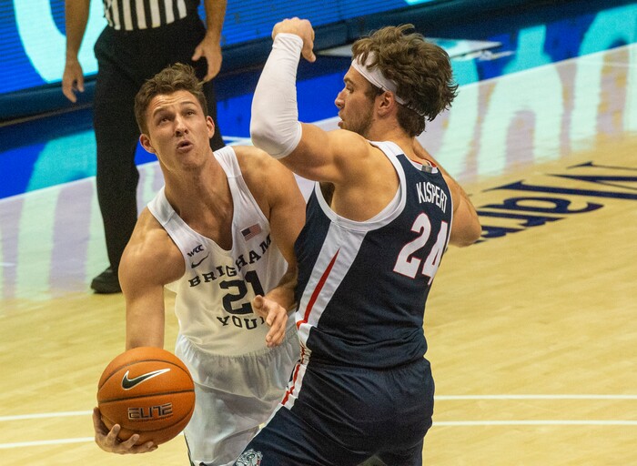 (Rick Egan | The Salt Lake Tribune)  Brigham Young Cougars guard Trevin Knell (21) tries to shoot around Gonzaga Bulldogs forward Corey Kispert (24), in West Coast Conference Basketball action between the Brigham Young Cougars and the Gonzaga Bulldogs at the Marriott Center in Provo, on Monday, Feb. 8, 2021.