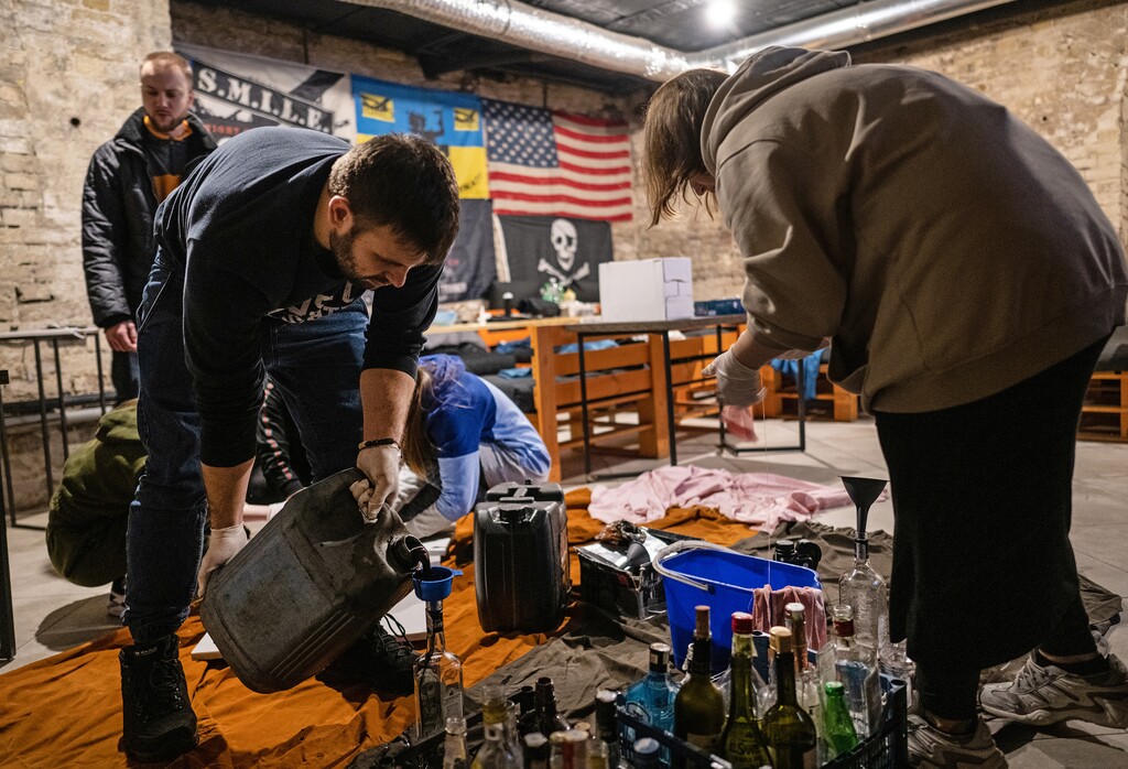 (Lynsey Addario for The New York Times)
Ukrainians make Molotov cocktails in preparation to fight against Russian forces in Kyiv, Ukraine, March 2, 2022. "The events in Ukraine have been a moral atrocity and a political tragedy, but for people around the world, a cultural revelation," writes The New York Times columnist David Brooks.