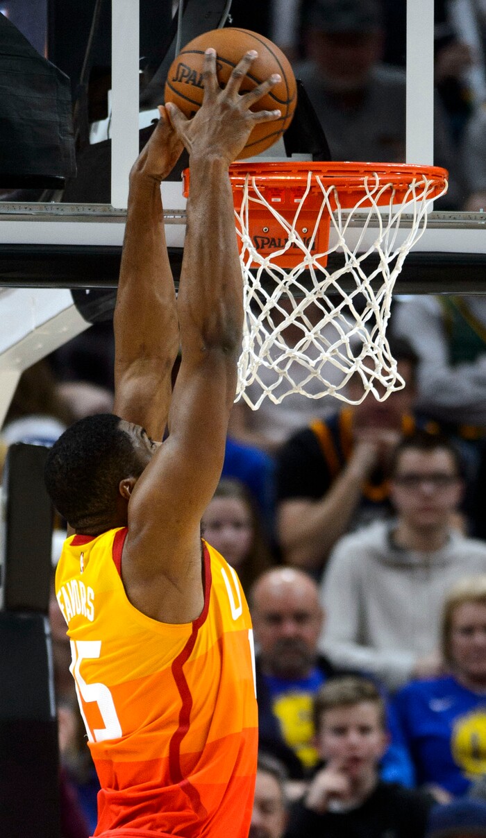 (Steve Griffin  |  The Salt Lake Tribune) dUtah Jazz forward Derrick Favors (15) gets free for a dunk uring the Utah Jazz versus Golden State Warriors at Vivint Smart Home Arena in Salt Lake City Tuesday January 30, 2018.