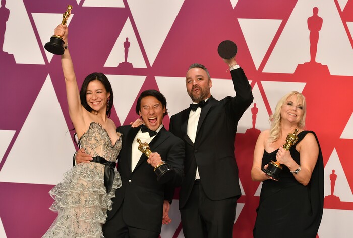 Elizabeth Chai Vasarhelyi, from left, Jimmy Chin, Evan Hayes, and Shannon Dill pose with the award for best documentary feature for "Free Solo" at the Oscars on Sunday, Feb. 24, 2019, at the Dolby Theatre in Los Angeles. (Photo by Jordan Strauss/Invision/AP)