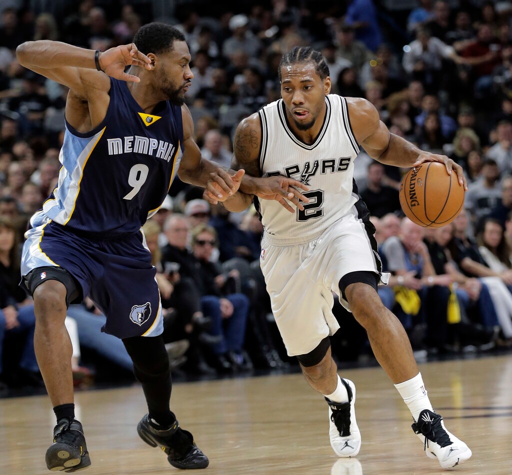 San Antonio Spurs forward Kawhi Leonard (2) drives around Memphis Grizzlies guard Tony Allen (9) during Game 2 of a first-round NBA basketball playoff series, Tuesday, April 19, 2016, in San Antonio, Texas. (AP Photo/Eric Gay)