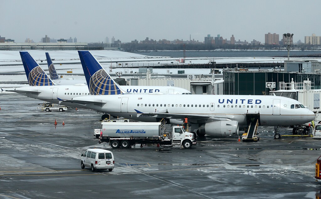 (Seth Wenig | The Associated Press) In this March 15, 2017, file photo, United Airlines jets sit on the tarmac at LaGuardia Airport in New York. A dog died on a United Airlines plane after a flight attendant ordered its owner to put the animal in the plane's overhead bin. United said Tuesday, March 13, 2018, that it took full responsibility for the incident on the Monday night flight from Houston to New York.