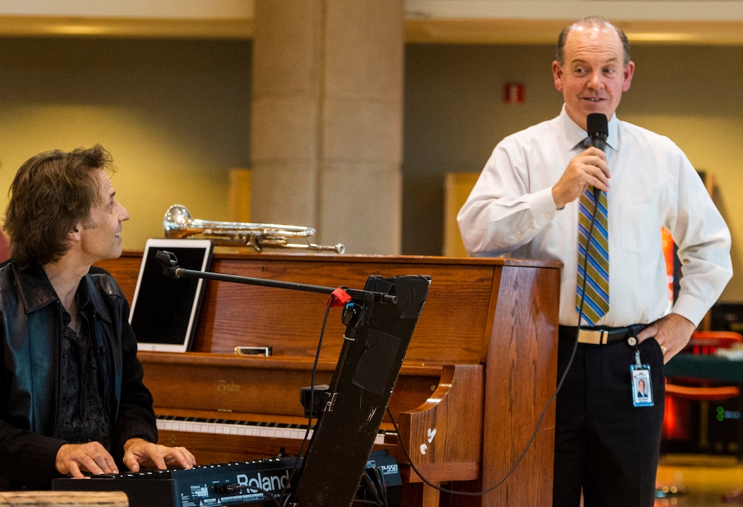 (Rick Egan  |  The Salt Lake Tribune)    Kurt Bestor sings along with hospital administrator,Kevin Martin, during an intimate one-man show at Shriners' Hospital, Tuesday, Nov. 19, 2019.