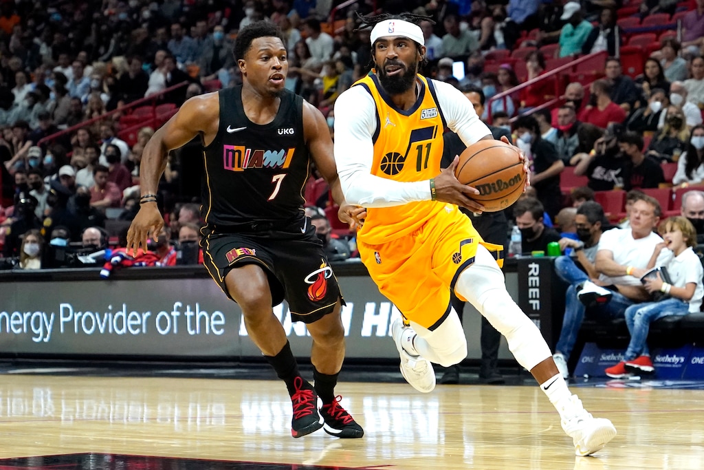 Utah Jazz guard Mike Conley (11) drives to the basket as Miami Heat guard Kyle Lowry (7) defends during the first half of an NBA basketball game, Saturday, Nov. 6, 2021, in Miami. (AP Photo/Lynne Sladky)
