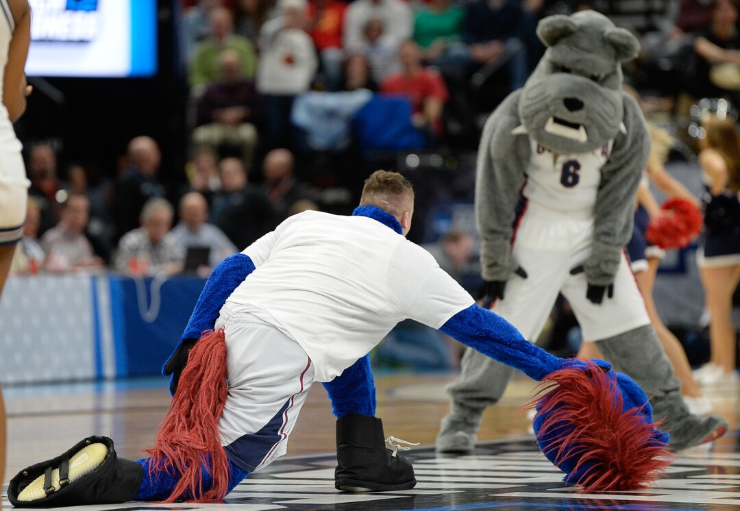 (Francisco Kjolseth  |  The Salt Lake Tribune)  The Fairleigh Dickinson mascot loses his head doing the splits as Gonzaga faces Fairleigh Dickinson in their first round menÕs NCAA March Madness tournament game at Vivint Smart Home Arena in Salt Lake City on Thursday, March 21, 2019.