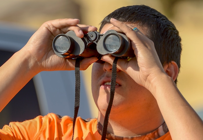 Leah Hogsten  |  The Salt Lake Tribune    Martin Garcia of Herriman watches as the blaze burns 1/4mile from his home. Garcia waited for hours to be allowed to get back to his wife and children who did not leave their home as the fire burned. A 50-acre wildfire in Rose Canyon was threatened about a half-dozen homes Wednesday, Sept. 12, 2018. A spokesman for Unified Fire said the blaze has already burned a few structures, including outhouses and sheds. Firefighters have evacuated around 20 to 30 homes in two neighborhoods near 15555 S. Rose Canyon Road in Herriman. 