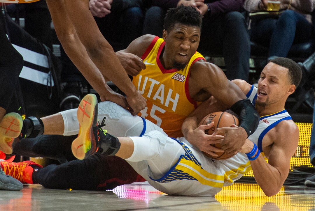 (Rick Egan  |  The Salt Lake Tribune)  Utah Utah Jazz guard Donovan Mitchell (45) goes for a loose ball along with Golden State Warriors guard Stephen Curry (30), in NBA action between Utah Jazz and Golden State Warriors, in Salt Lake City, Wednesday, Dec. 19, 2018.