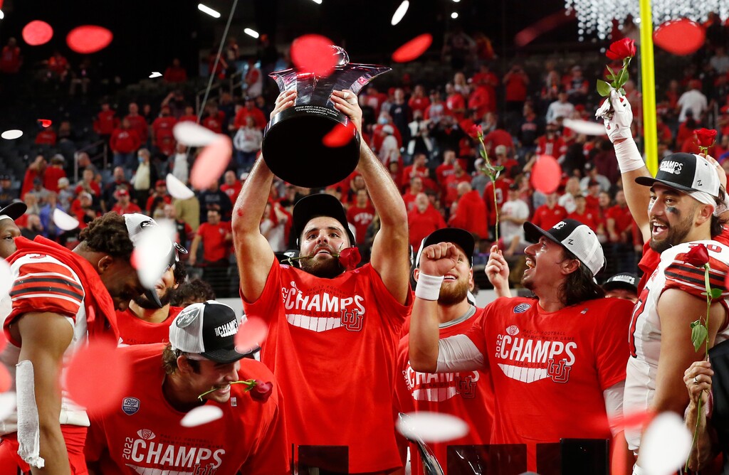 Utah tight end Thomas Yassmin holds up the trophy and celebrates with teammates after Utah defeated Southern California 47-24 in the Pac-12 Conference championship NCAA college football game Friday, Dec. 2, 2022, in Las Vegas. (AP Photo/Steve Marcus)