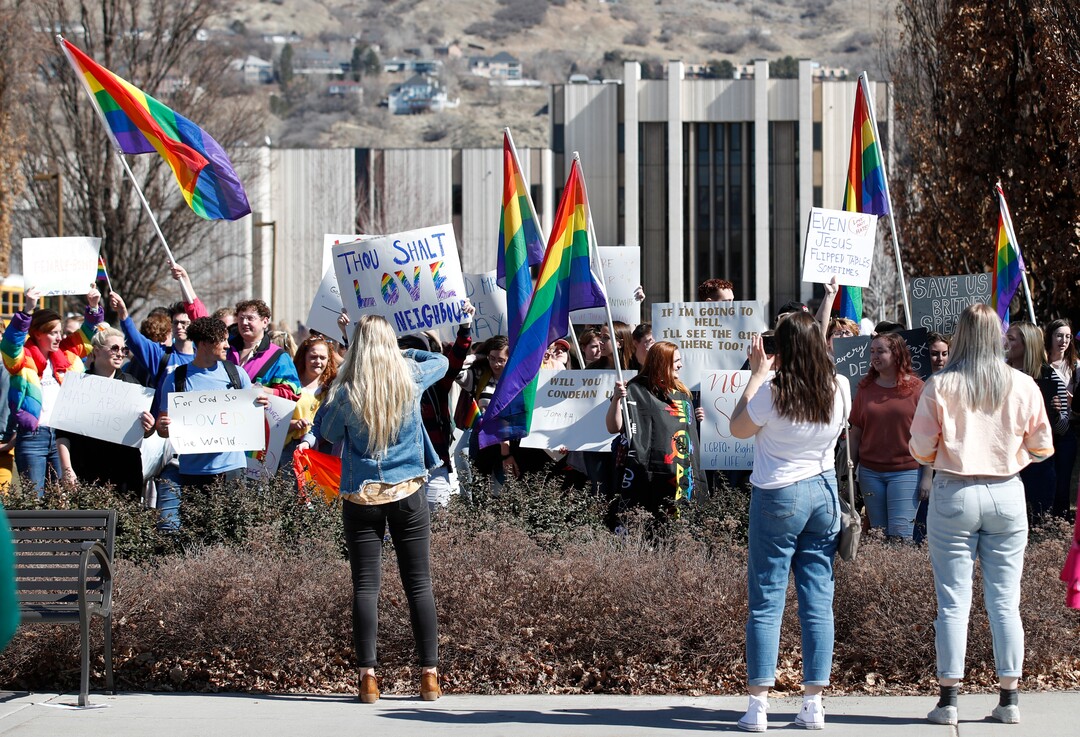 (George Frey  |  special to The Salt Lake Tribune) People take pictures and video of BYU students and others who gathered in front of the Ernest L. Wilkinson Student Center on the campus of Brigham Young University to protest BYUÕs rollback of a newly announced policy change on LGBTQ students on March 5, 2020 in Provo, Utah.