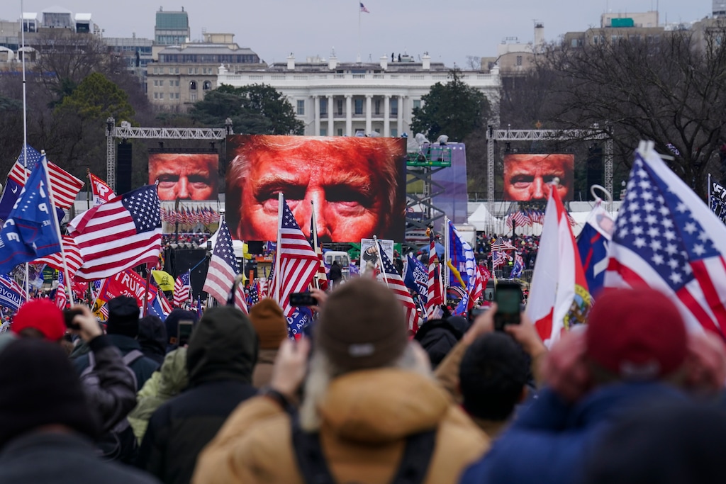 FILE - In this Jan. 6, 2021, file photo, Trump supporters participate in a rally in Washington. Far-right social media users for weeks openly hinted in widely shared posts that chaos would erupt at the U.S. Capitol while Congress convened to certify the election results. Selena Gomez is laying much of the blame for the violent attack on the U.S. Capitol at the feet of Big Tech. The singer told the leaders of Facebook, Twitter, Google and YouTube that they've allowed "people with hate in their hearts" to thrive and therefore "failed all the American people." It's just the latest in the 28-year-old Gomez's efforts to draw attention to the dangers of internet companies. In an exclusive interview with The Associated Press, Gomez explains why she's so passionate about the issue and what she's done both publicly and behind the scenes to get her message across. (AP Photo/John Minchillo, File)