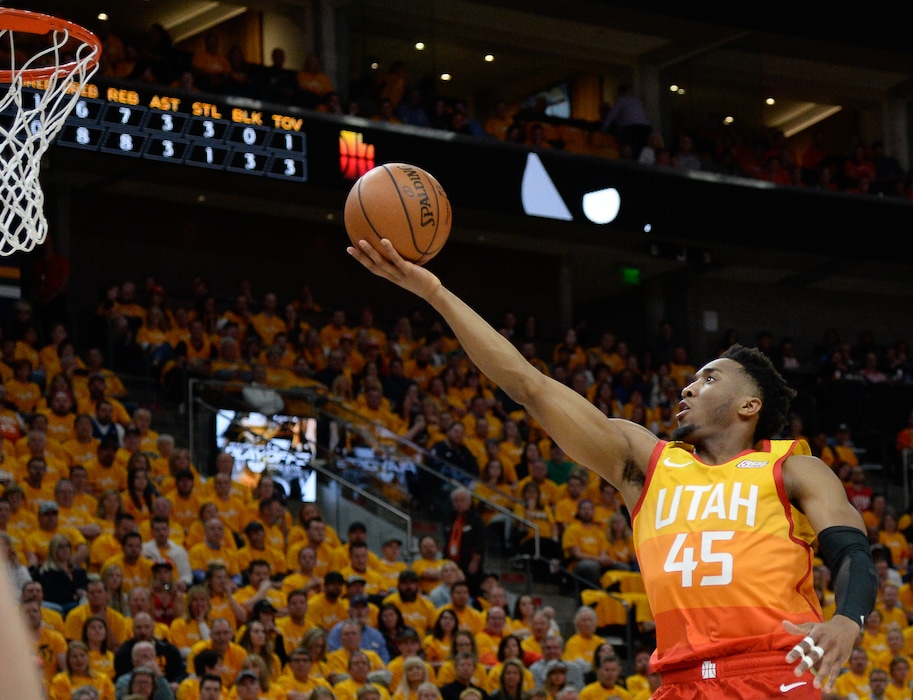 (Francisco Kjolseth | The Salt Lake Tribune) Utah Jazz guard Donovan Mitchell (45) sails it in over the Rockets in Game 3 of a first-round NBA basketball playoff series in Salt Lake City, Saturday, April 20, 2019.