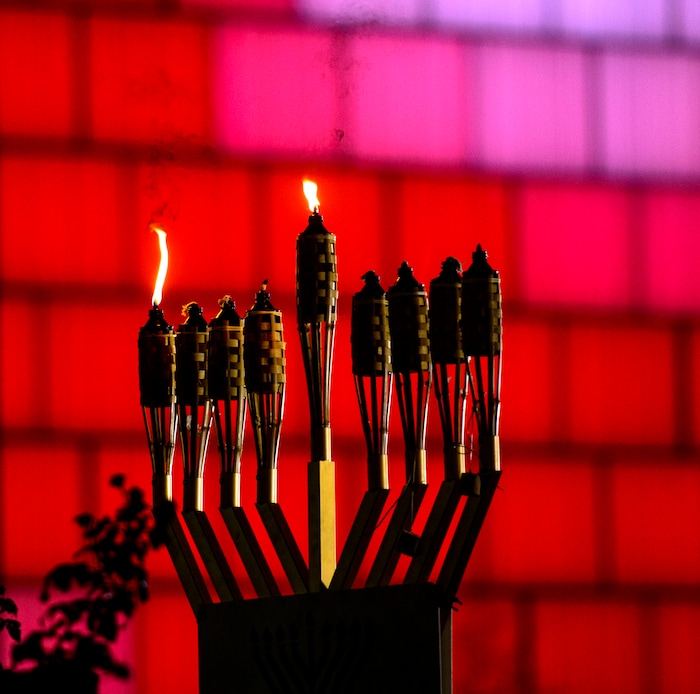 (Steve Griffin  |  The Salt Lake Tribune) A giant menorah  burns bright after being lit by Rabbi Benny Zippel of Chabad Lubavitch for the first night of Hanukkah, the Jewish eight day festival of lights outside, Abravanel Hall in Salt Lake City Tuesday December 12, 2017.