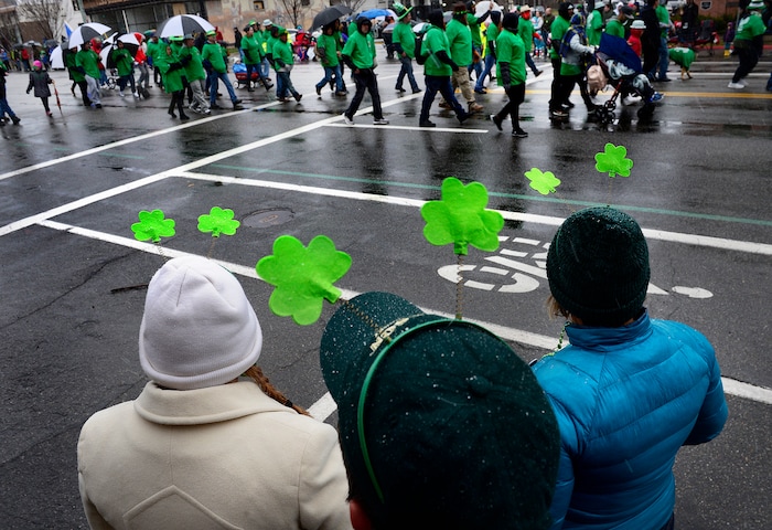 (Scott Sommerdorf | The Salt Lake Tribune) The Bussian and Switek families watch the 40th annual Salt Lake City St. Patrick's Day Parade on Saturday, March 17, 2018.