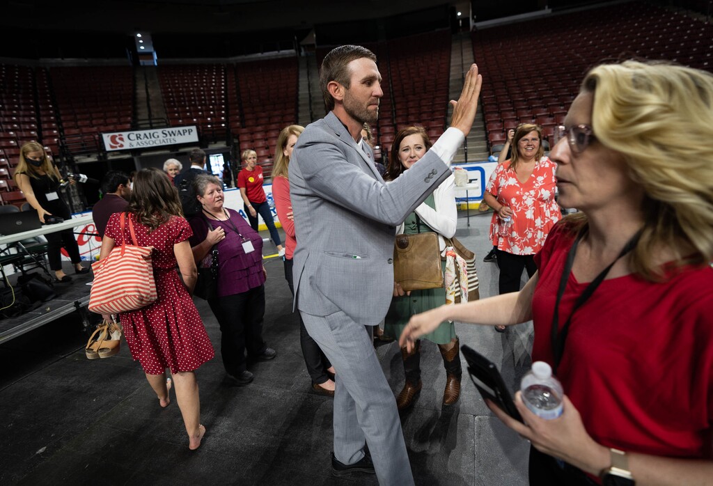(Francisco Kjolseth | The Salt Lake Tribune) Carson Jorgensen gives high fives after it is announced that he is the new Utah Republican Chairman following long awaiting voting during the party’s convention at the Maverik Center in West Valley City on Saturday, May 1, 2021.