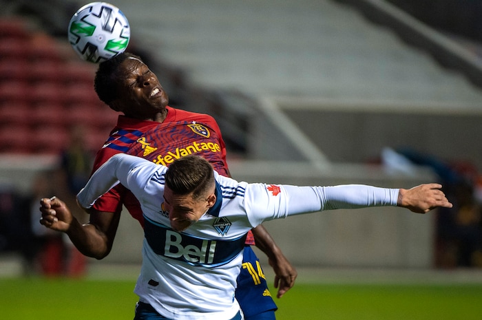 (Rick Egan  |  The Salt Lake Tribune)    Real Salt Lake defender Nedum Onuoha (14) heads a corner kick, as Vancouver Whitecaps defender Jake Nerwinski (28) defends, in MLS soccer action between Real Salt Lake and the Vancouver Whitecaps at Rio Tinto Stadium on Saturday, Sept. 19, 2020.

 
 