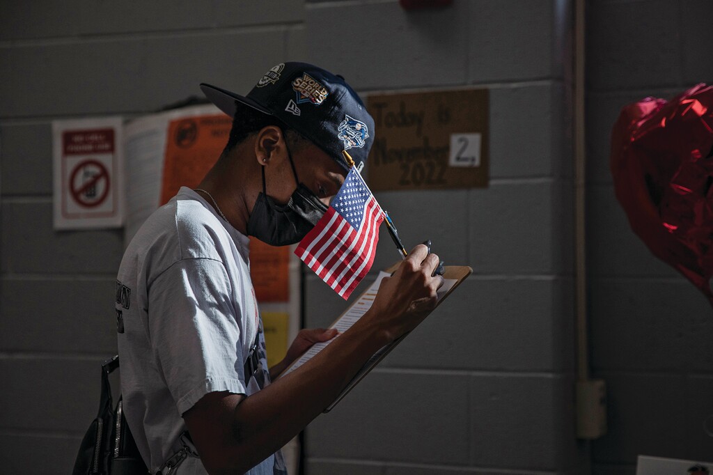 FILE — A voter registers during early voting in Atlanta, Nov. 2, 2022. “The political world, especially the Democratic Party, has long been in search of the secret formula for wooing younger voters to the polls,” writes Michelle Cottle. (Damon Winter/The New York Times)