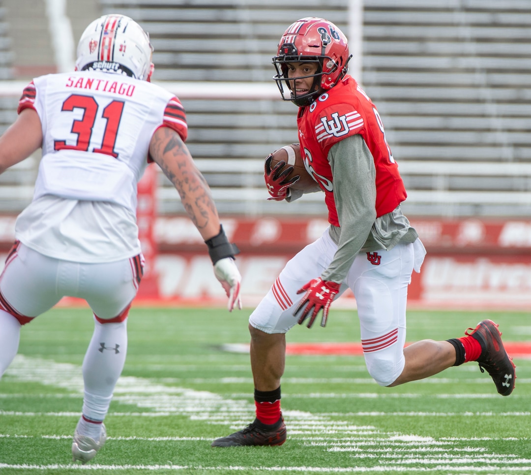 (Rick Egan  |  The Salt Lake Tribune) Wide Receiver Devaught Vele runs the ball, as Keala Santiago defends, in Utah's spring Red-White game at Rice-Eccles Stadium, Saturday, April 13, 2019.