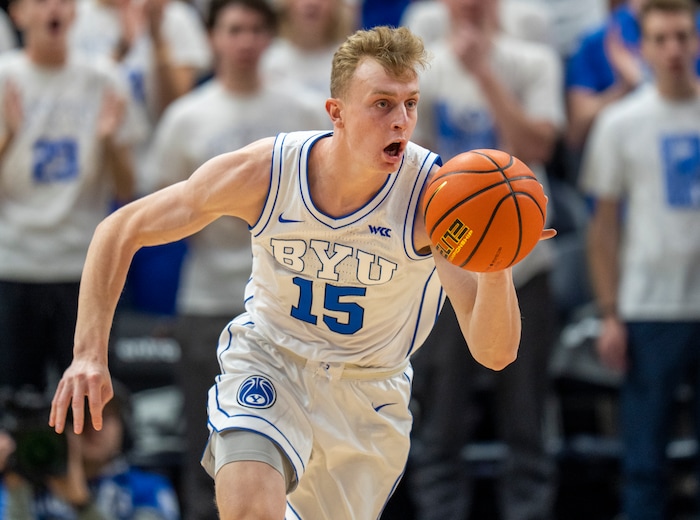 (Rick Egan | The Salt Lake Tribune)  Brigham Young guard Richie Saunders (15) leads a cougar fast break, in basketball action between the Brigham Young Cougars and the South Dakota Coyotes, at Vivint Arena, in Salt Lake City, on Saturday, Dec. 3, 2022.
