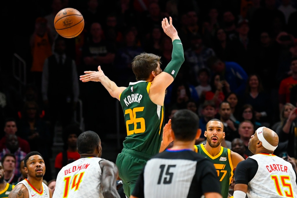 Utah Jazz guard Kyle Korver's shot is blocked along with being fouled during the closing moments of an NBA basketball game against the Atlanta Hawks, Thursday, March 21, 2019, in Atlanta. (AP Photo/John Amis)