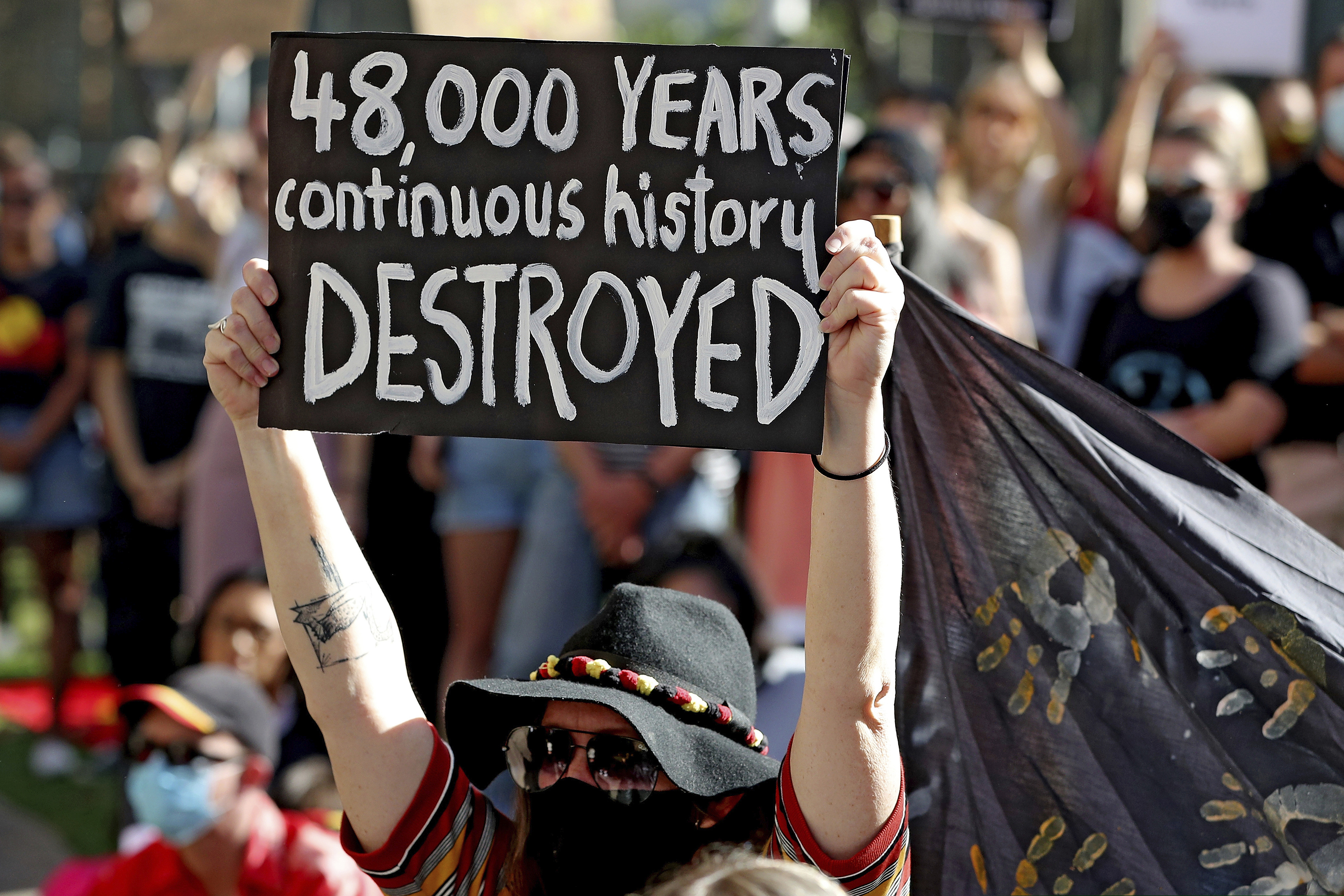 (Richard Wainwright | AAP Image via AP)  Protesters rally outside the Rio Tinto office after the destruction of Australian Indigenous sacred sites in Perth, June 9, 2020. Rio Tinto chief executive Jean-Sebastien Jacques will leave the Anglo-Australian mining giant by March over the destruction of the sacred sites, the company said on Friday, Sept. 11, 2020.