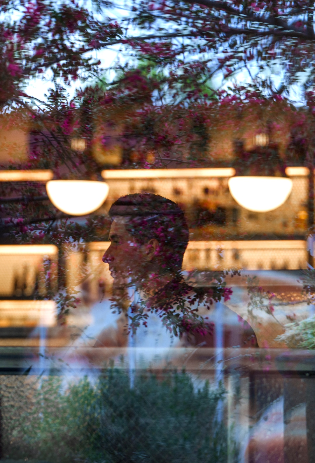(Leah Hogsten | The Salt Lake Tribune) Emigration Cafe bartender Aaron Jeffers greats diners during the restaurant's opening night, Wednesday, April 27, 2022. Emigration Cafe's menu features Roman style wood fired pizza, salads, sandwiches and mains.