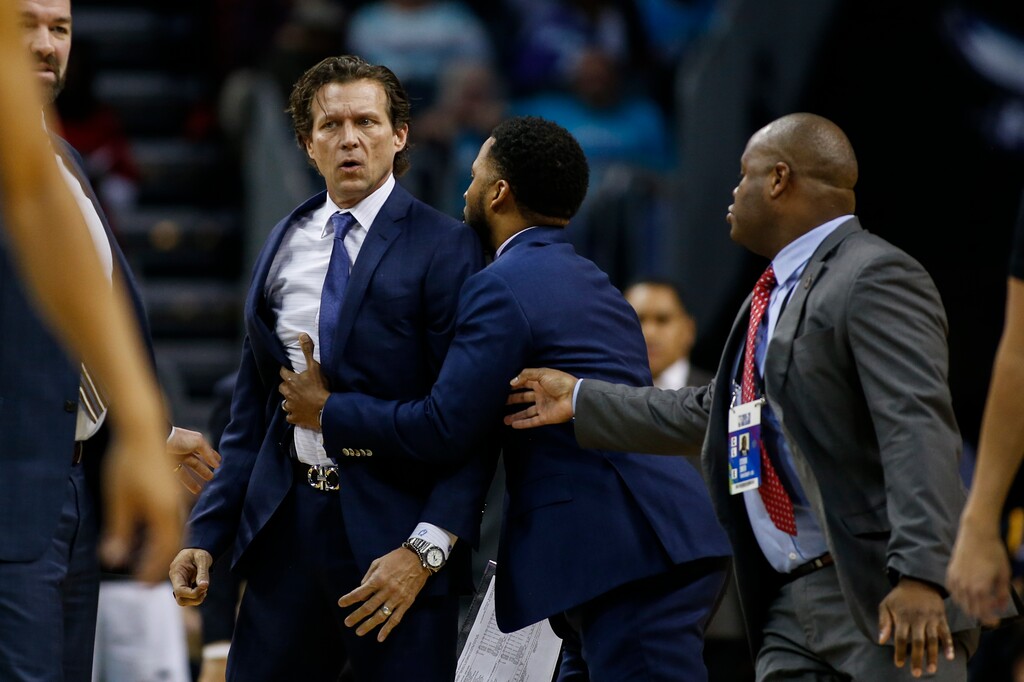 Utah Jazz head coach Quin Snyder, left, is restrained after being ejected from the game as the Jazz play the Charlotte Hornets in the second half of an NBA basketball game in Charlotte, N.C., Saturday, Dec. 21, 2019. Utah won 114-107. (AP Photo/Nell Redmond)