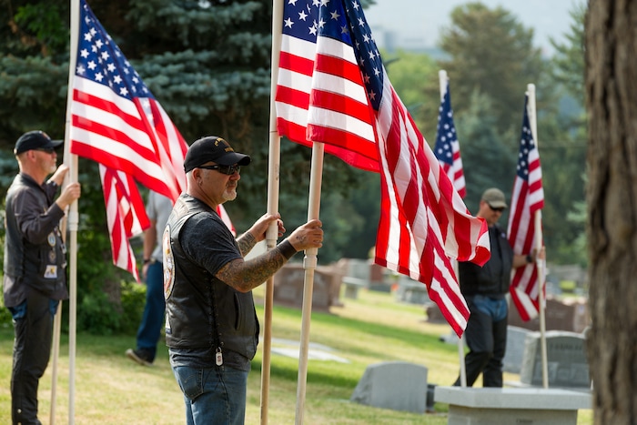(Alex Gallivan  |  Special to The Tribune) Marine Pfc. Robert K. Holmes, who died 77 years ago aboard the USS Oklahoma during the attack on Pearl Harbor, is laid to rest in the Salt Lake City Cemetery, Monday, Aug. 20, 2018.