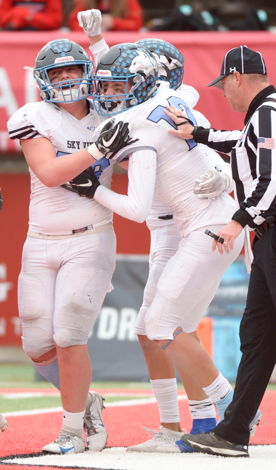 (Leah Hogsten  |  The Salt Lake Tribune)  Sky ViewÕs Mason Falslev celebrates a touchdown with Jaxon Wilson and Scout Morris. Sky View High School defeated Park City 35-0 to win the 4A State Championship football title, Nov. 11, 2019 at Rice-Eccles Stadium.