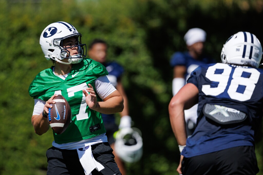 (Jaren Wilkey | BYU) Cougars quarterback Bear Bachmeier drops back with the football during fall camp in Provo, Aug. 2, 2025.