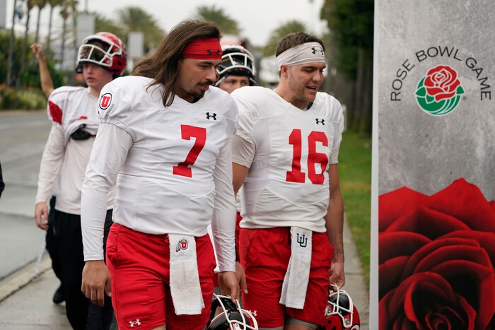 (Marcio Jose Sanchez | AP) Utah quarterbacks Cameron Rising (7) and Bryson Barnes (16) walk to practice ahead of the Rose Bowl NCAA college football game against Penn State, Friday, Dec. 30, 2022, in Carson, Calif.