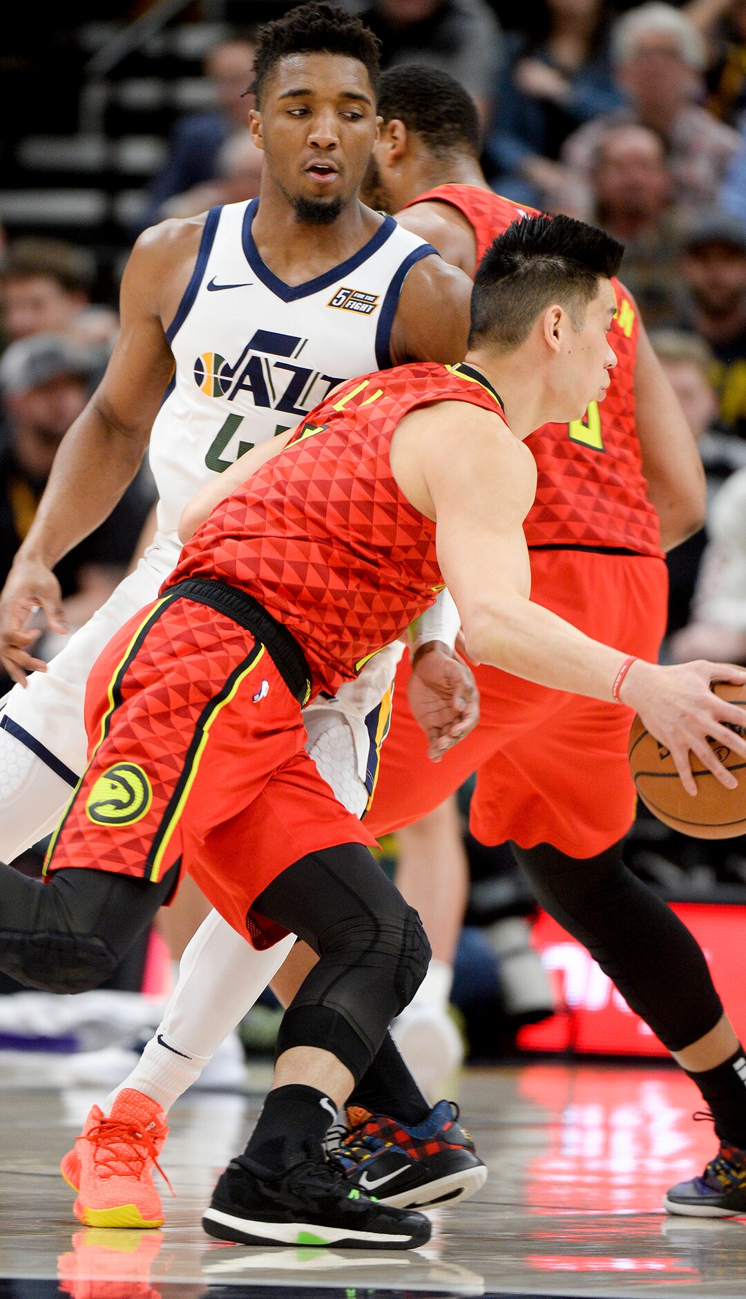 Leah Hogsten  |  The Salt Lake Tribune  Utah Jazz guard Donovan Mitchell (45) is called with a foul as Atlanta Hawks guard Trae Young (11) passes as the Utah Jazz take on the Atlanta Hawks, Feb. 1, 2019 at Vivint Smart Home Arena. 