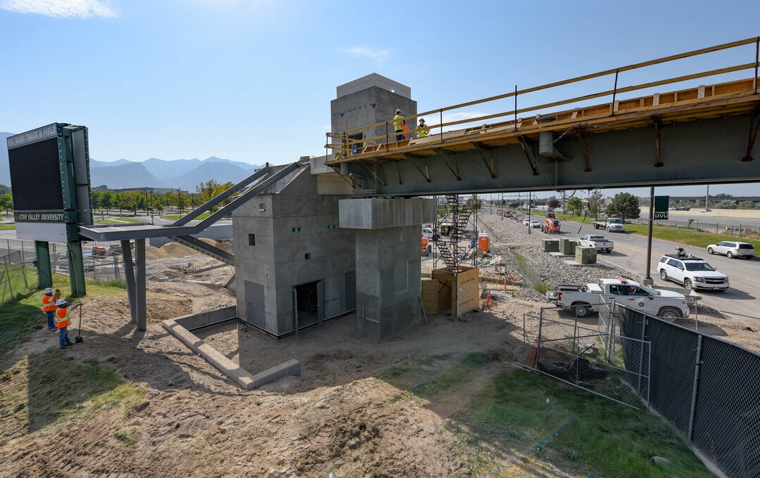 (Francisco Kjolseth  |  The Salt Lake Tribune) UDOT gives a tour of the state’s new longest pedestrian bridge on Thursday, August 20, 2020, connecting Utah Valley University in Orem to student housing and the community on the West side of I-15. Crews are finishing up an extensive hydronic heating system that will pump warm water to keep the bridge clear of snow in the winters, as it gets ready to pour concrete for the walking surface. UDOT will close I-15 in both directions this weekend for work on the nearly 1,000 foot bridge that is 15 feet wide to accommodate pedestrians, cyclists and scooters. Elevators and stairs with small ramps to push up bicycles will be on each side of the bridge.